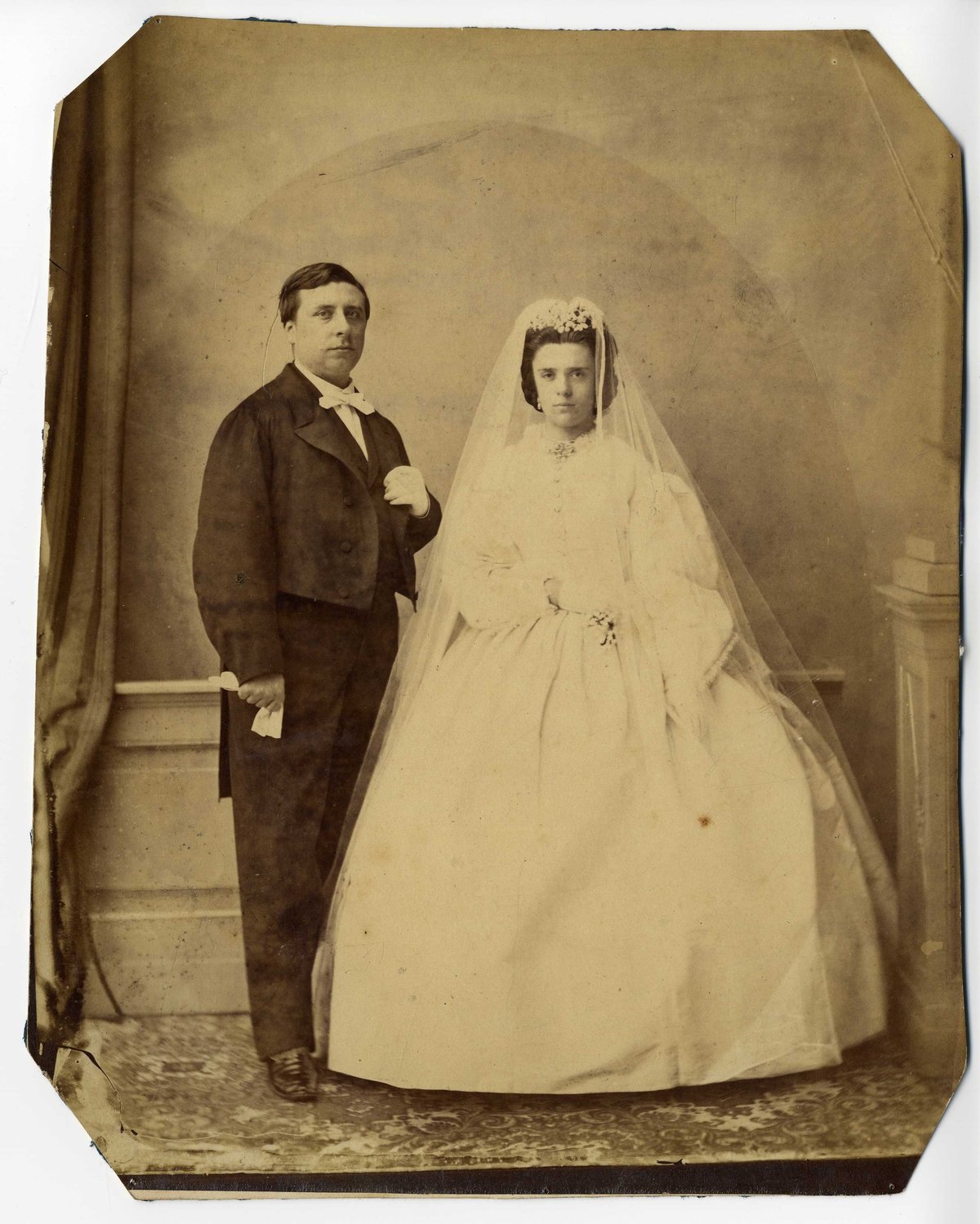 The lady of the house, Cornelia, chooses a white wedding dress for her wedding to Simon van Gijn. - 1864